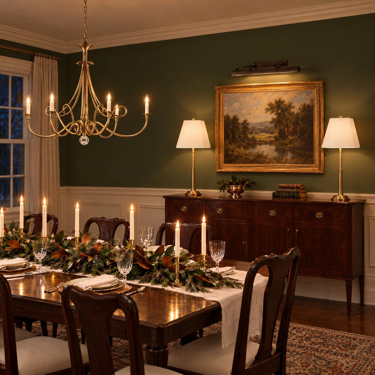 Shop the look: Holiday dining room with an antique brass twisted-arm chandelier over a candlelit table, slim antique brass buffet lamps with linen shades on the sideboard, and a bronze picture light over a landscape painting