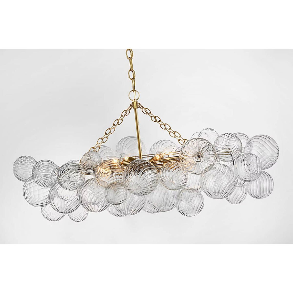 Julie Neill Talia Medium Linear Chandelier in Gild with Clear Swirled Glass W26.25" x 51" x H21.75"