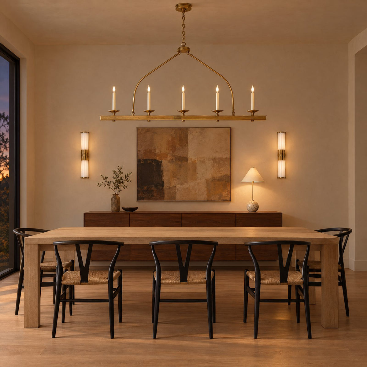 Shop the look: Minimalist dining room with a Chapman & Myers Launceton brass linear pendant over an oak table, Carew linear sconces flanking art and a Kelly Wearstler Cleo orb accent lamp on the sideboard