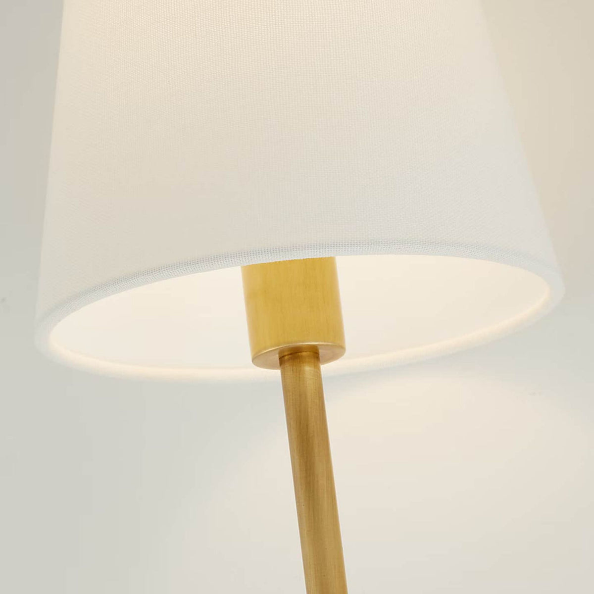 Amber Lewis Griffin Tail Sconce in Hand-Rubbed Antique Brass and Saddle Leather with Linen Shade W6.5" x H21" x E6.5"