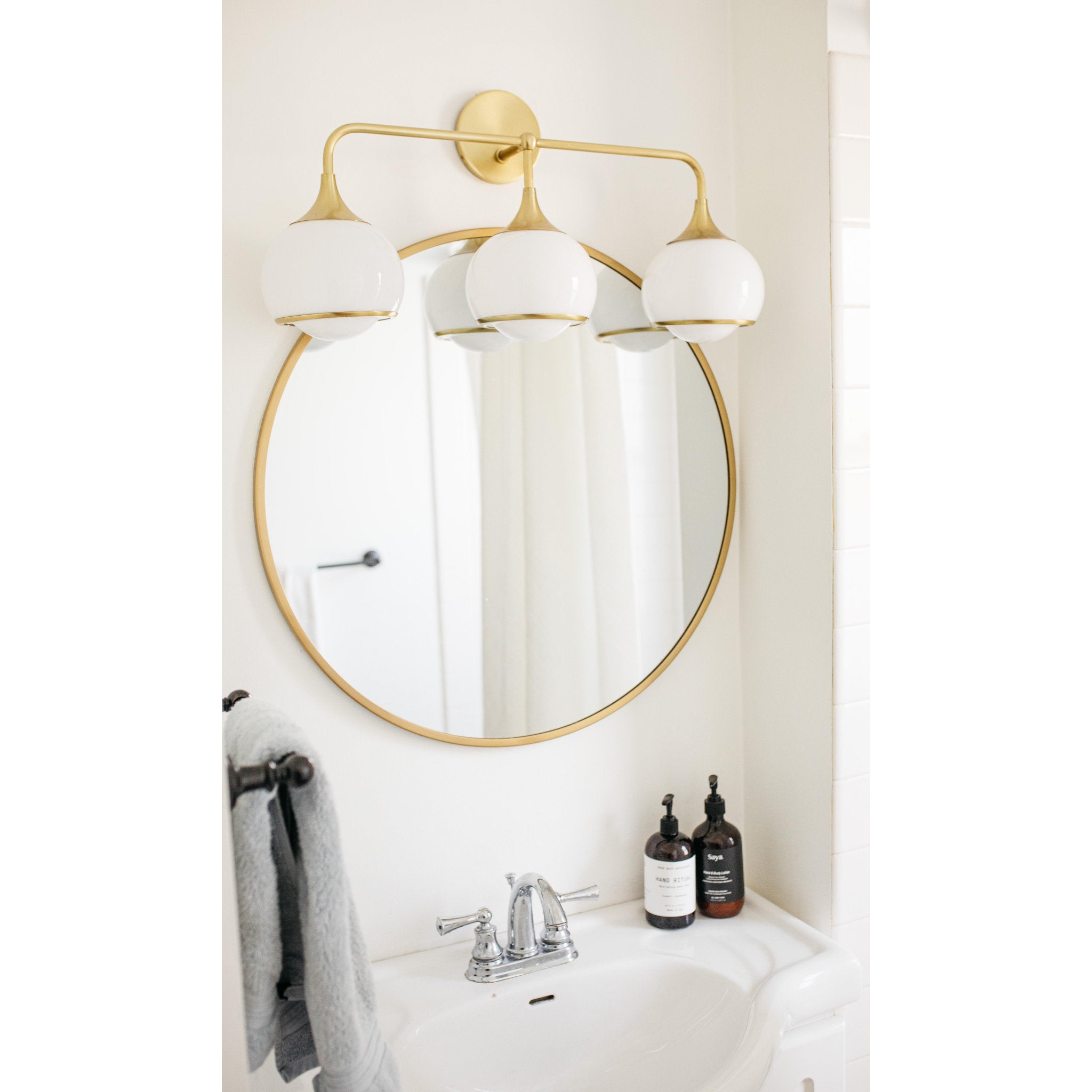 Reese 3-Light Bath and Vanity in Aged Brass 5.5L x 26.75W x 11.25H