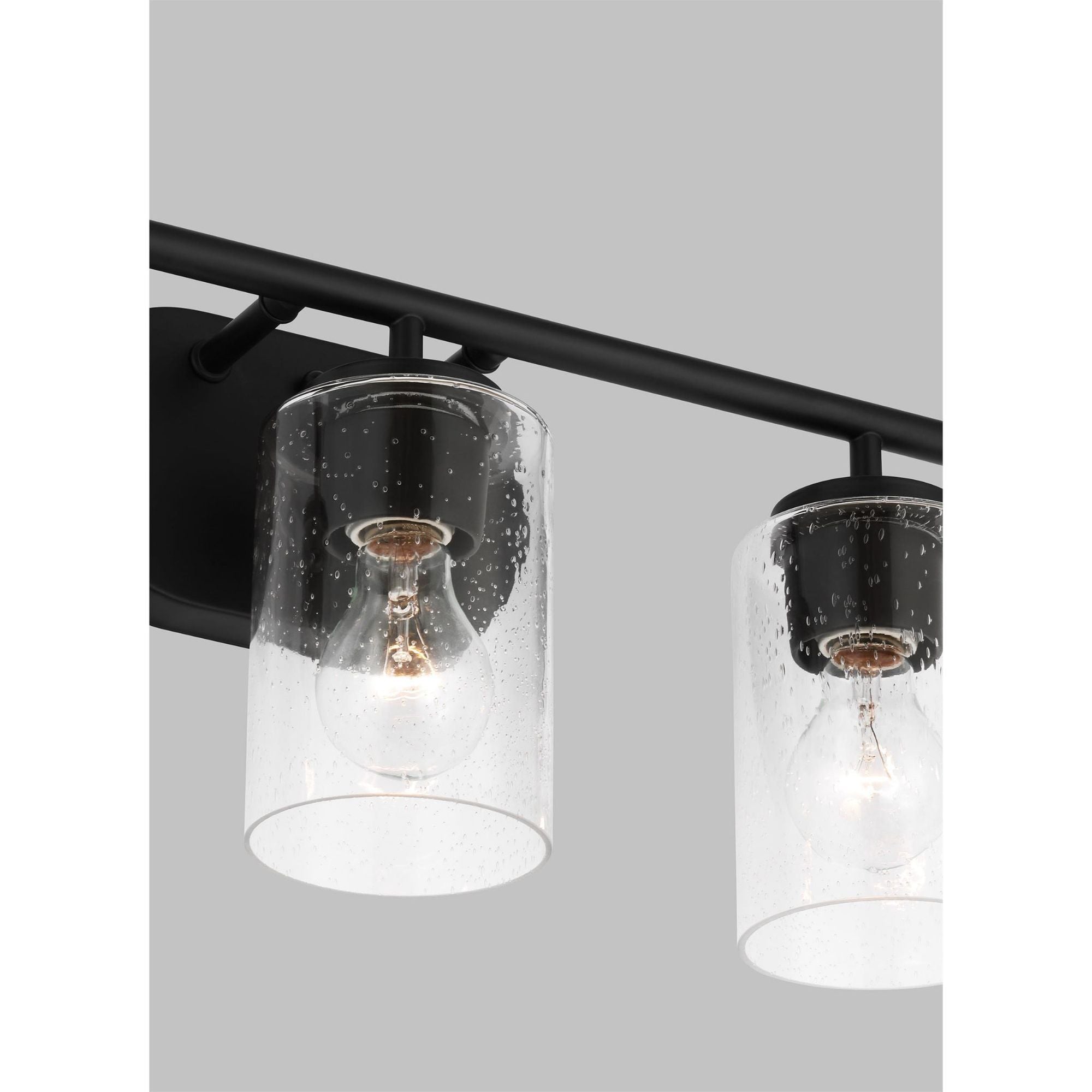 Oslo Three Light Wall / Bath Contemporary Fixture 20" Width 8.5" Height Steel Round Clear Seeded Shade in Midnight Black