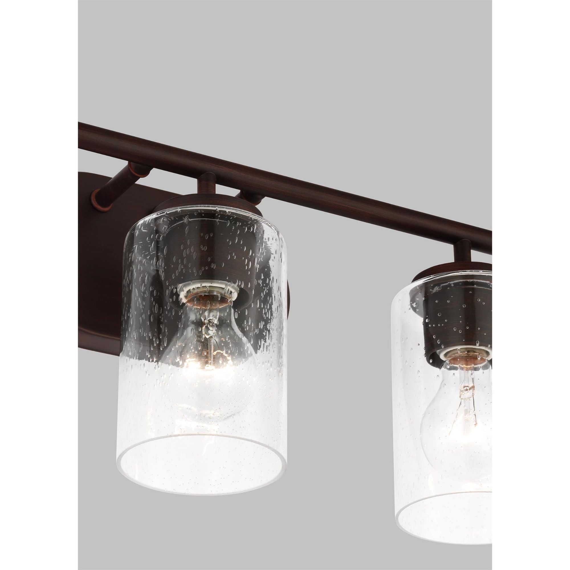 Oslo Three Light Wall / Bath Contemporary Fixture 20" Width 8.5" Height Steel Round Clear Seeded Shade in Bronze