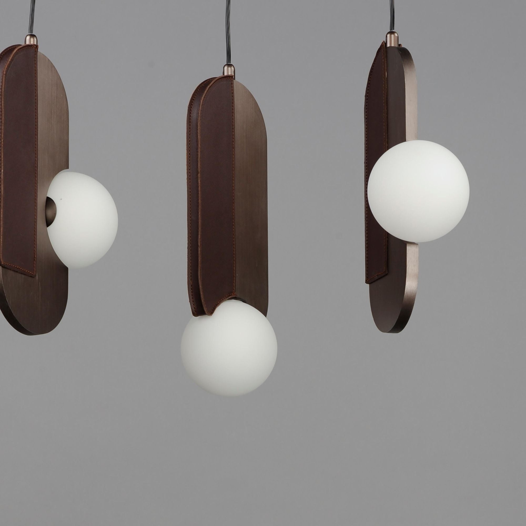 Studio M SM24608BBZ Stitched 8-Light Pendant in Brushed Bronze by Nina Magon