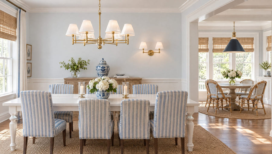 Blue and white dining room with a Mark D. Sikes Classic No.1 aged brass chandelier, a Classic No.1 two-light sconce above the sideboard, and a Painted No. 2 Darkest Blue pendant over the breakfast table