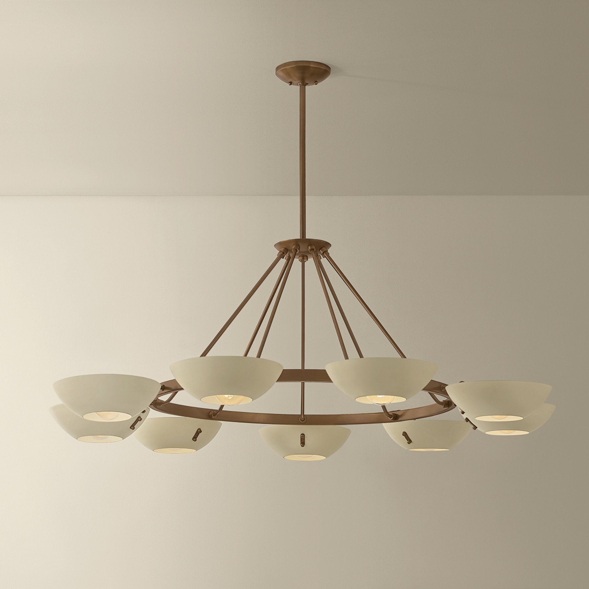 Alturas 9-Light Chandelier in Patina Brass 55W x 20.25H