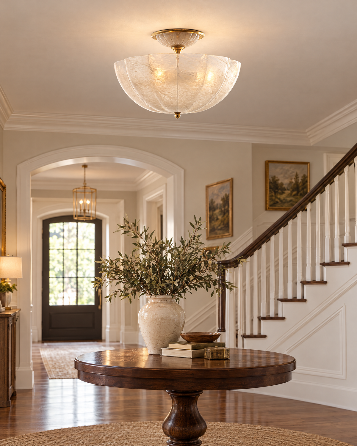 AERIN Rosehill semi-flush in antique brass, styled in a room