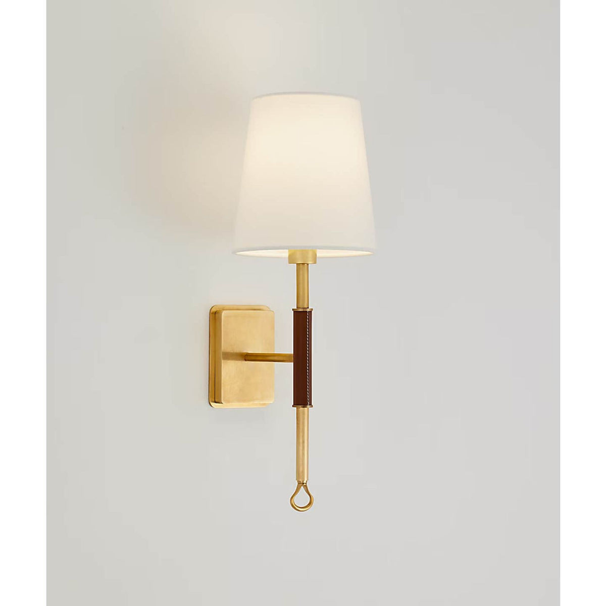 Amber Lewis Griffin Sconce in Hand-Rubbed Antique Brass and Saddle Leather with Linen Shade W5.75" x H15.75" x E7.25"