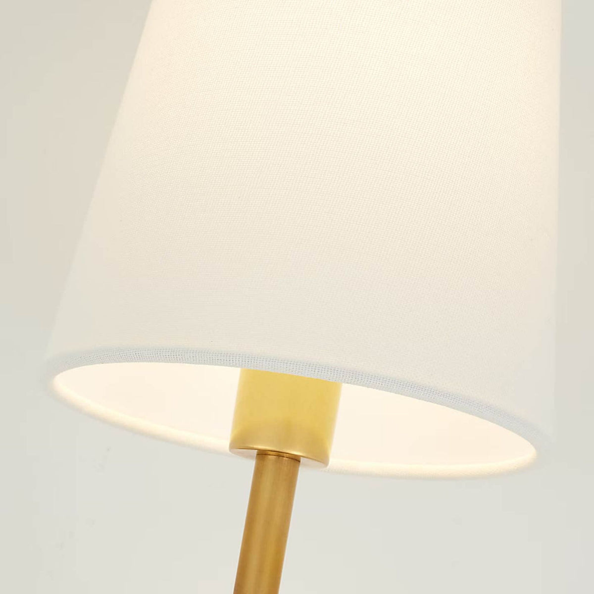 Amber Lewis Griffin Sconce in Hand-Rubbed Antique Brass and Saddle Leather with Linen Shade W5.75" x H15.75" x E7.25"