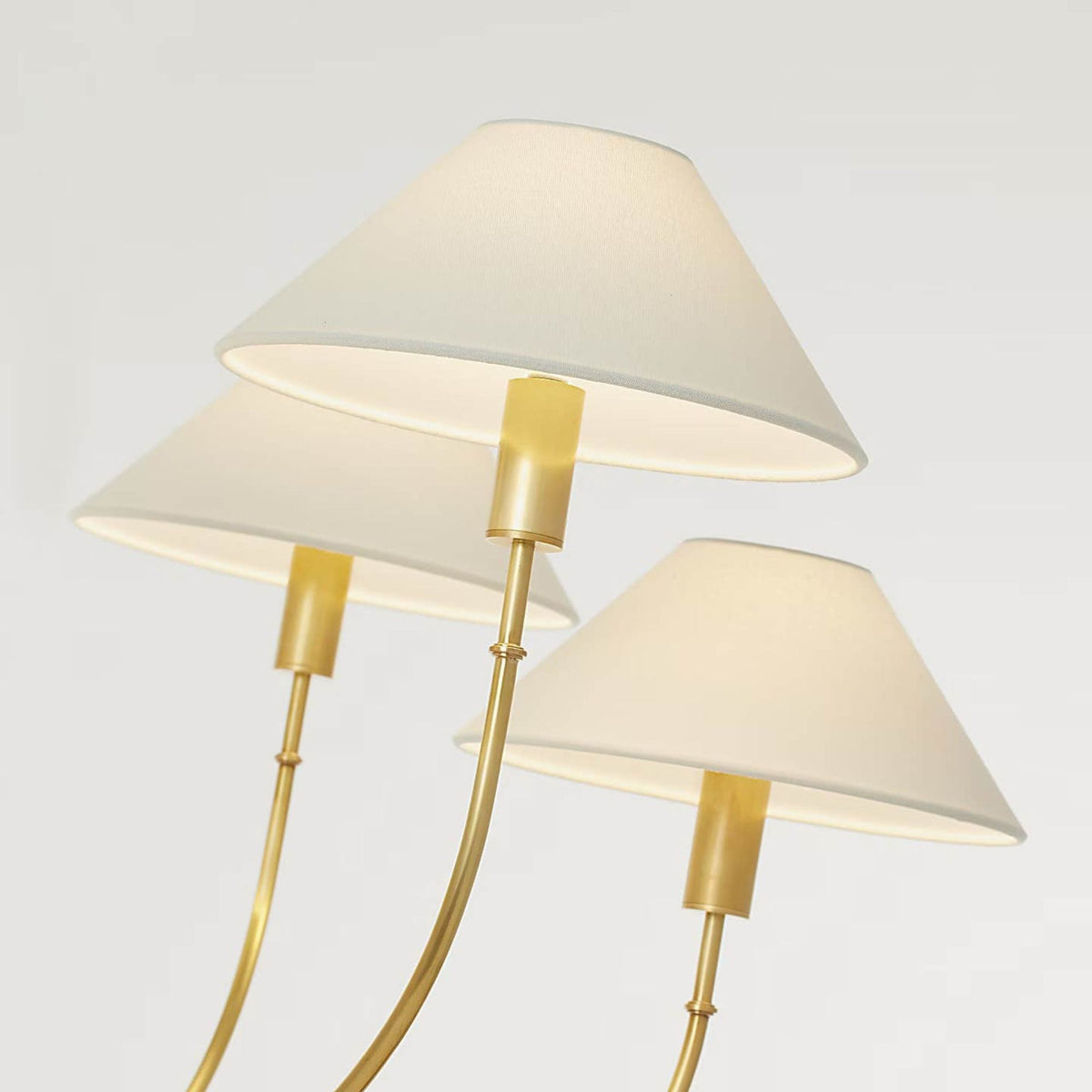 Amber Lewis Griffin Large Staggered Tail Chandelier in Hand-Rubbed Antique Brass and Saddle Leather with Linen Shades W36.5" x H35.5"