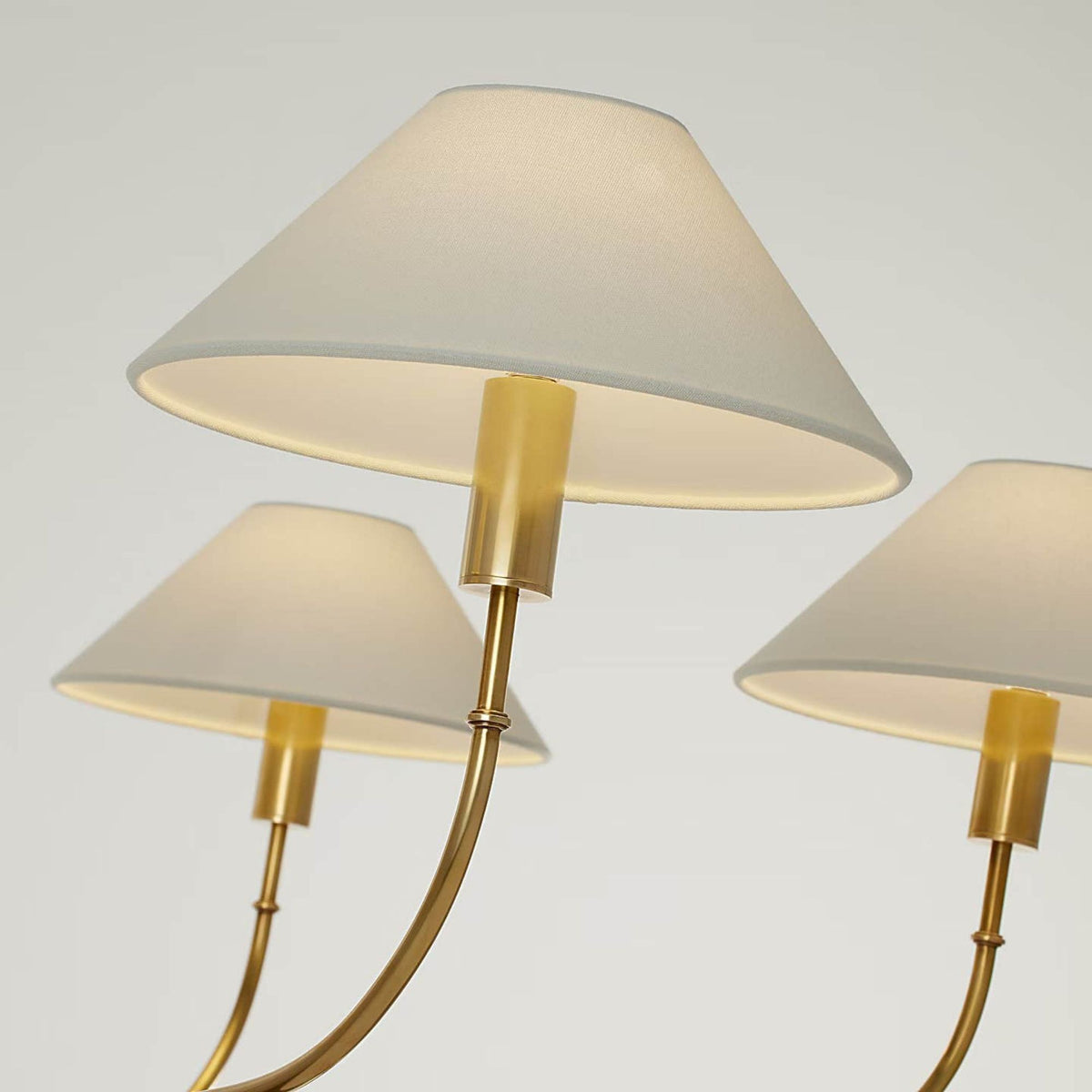 Amber Lewis Griffin Grande Tail Chandelier in Hand-Rubbed Antique Brass and Saddle Leather with Linen Shades W56" x H26.5"