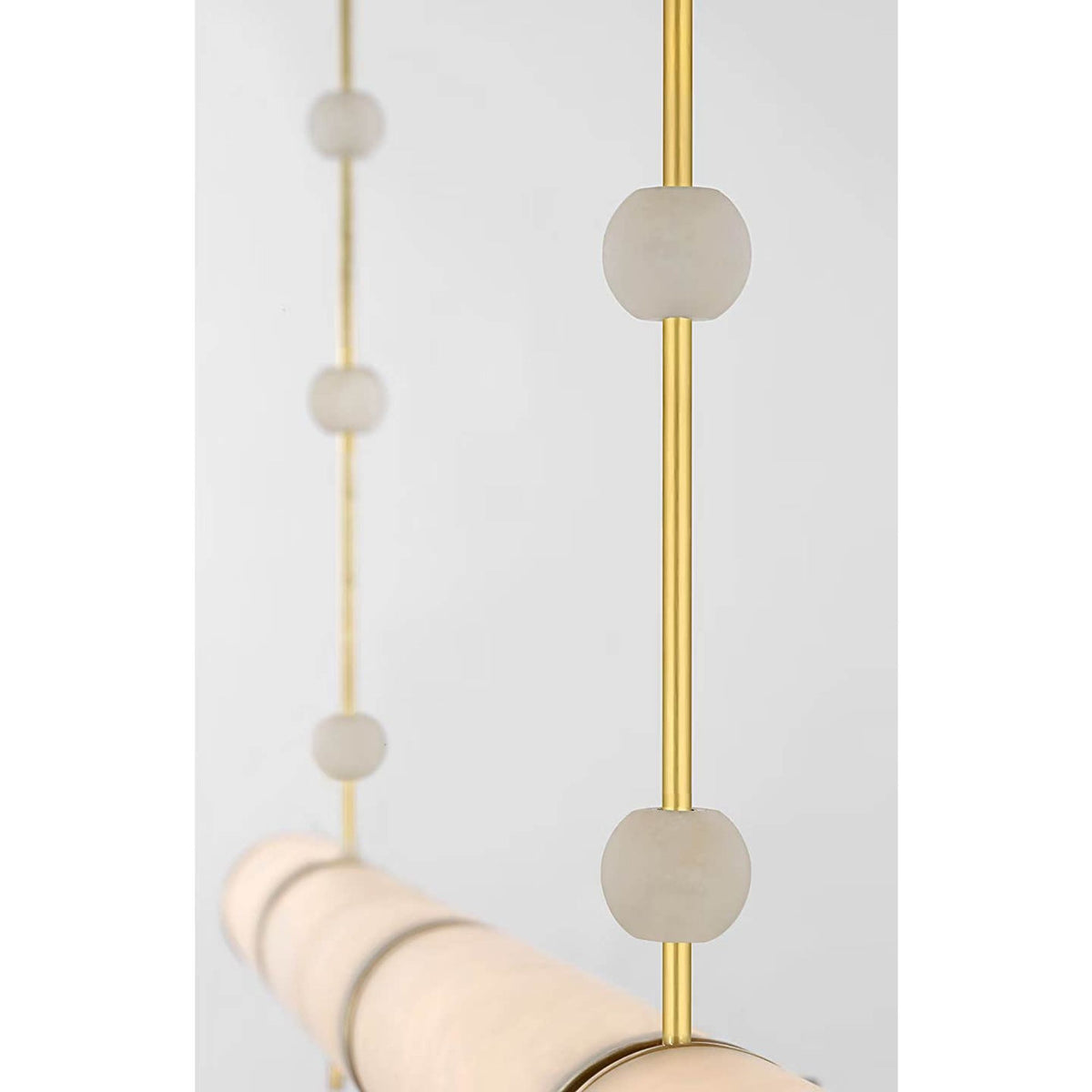Anne-Marie Barton Marcell 56" Linear Chandelier in Antique-Burnished Brass with Alabaster W2.75" x 56"