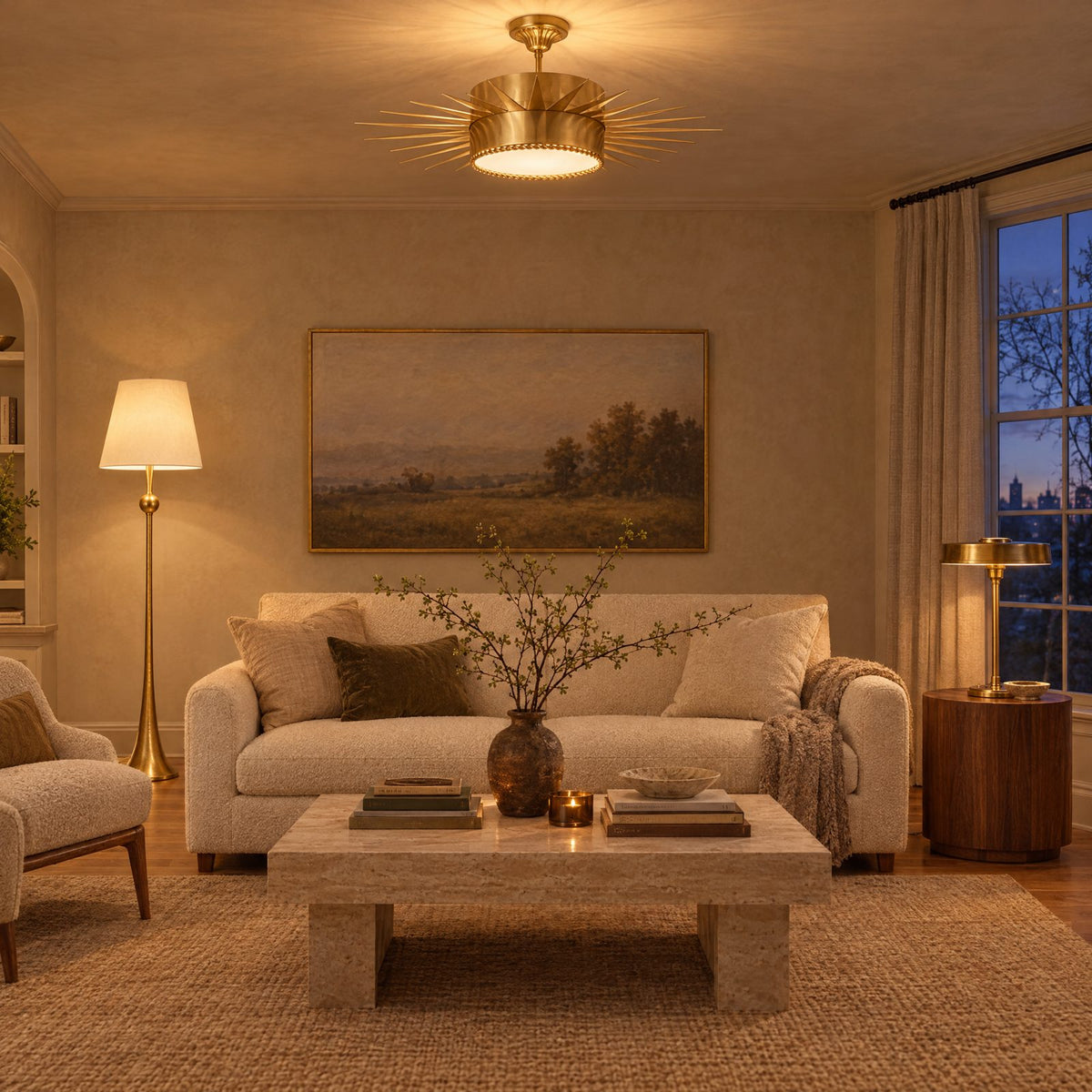 Shop the look: Warm 2700K living room with a brass Soleil semi-flush ceiling light, gilded AERIN Dover floor lamp and brass Carlo table lamp beside a cream sofa