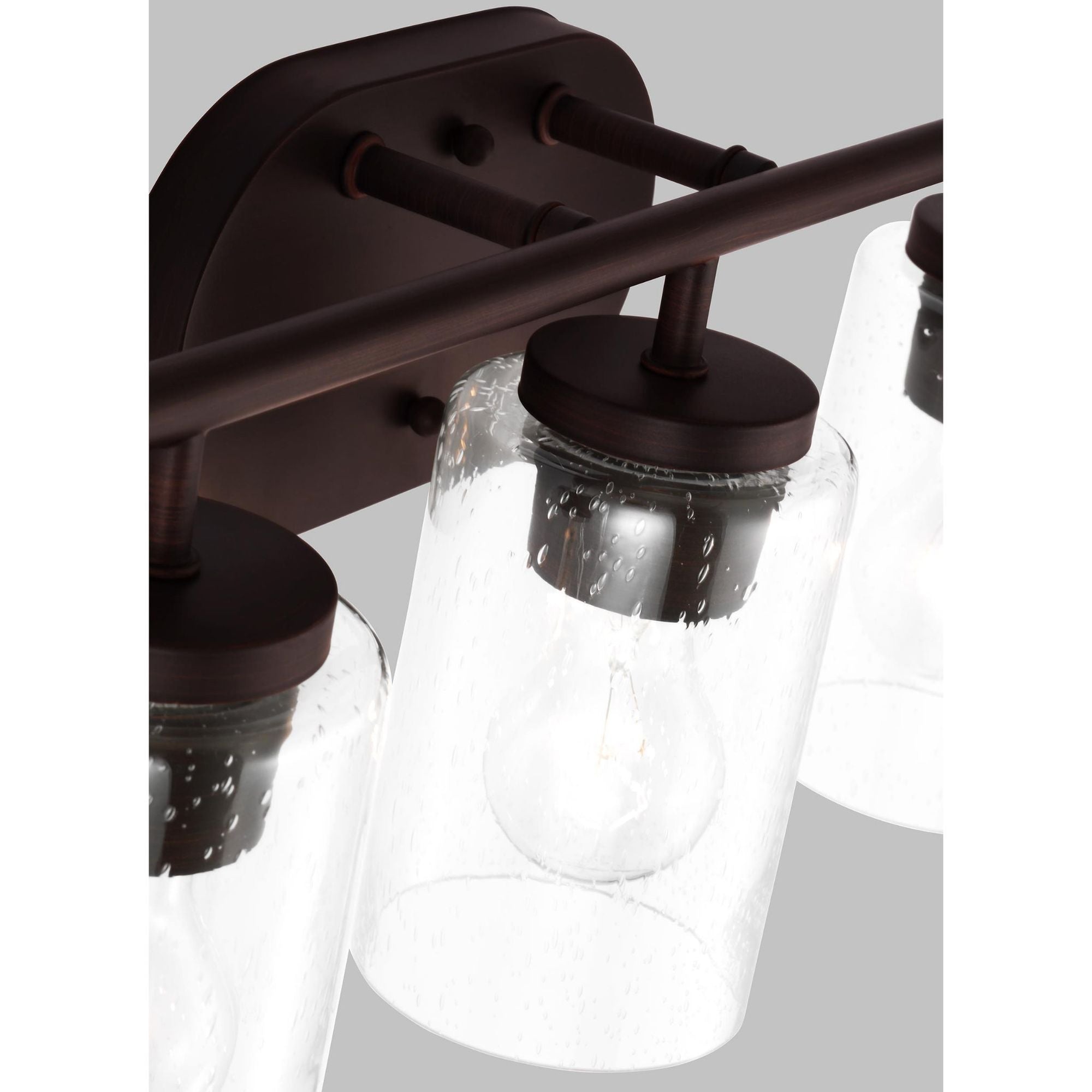Oslo Three Light Wall / Bath Contemporary Fixture 20" Width 8.5" Height Steel Round Clear Seeded Shade in Bronze