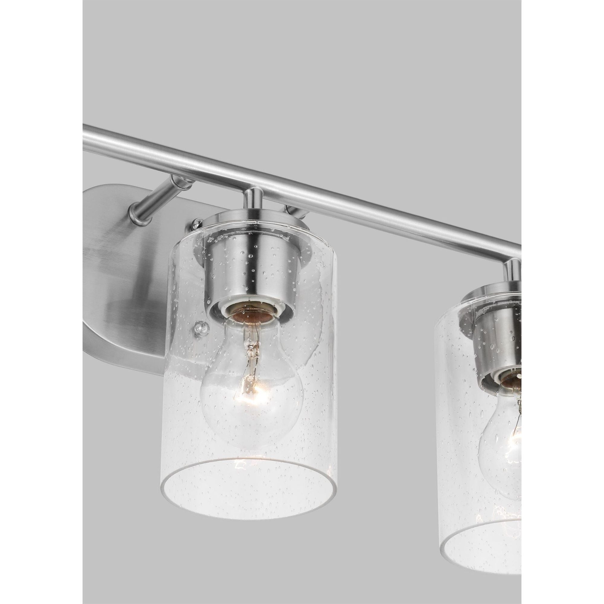 Oslo Three Light Wall / Bath Contemporary Fixture 20" Width 8.5" Height Steel Round Clear Seeded Shade in Brushed Nickel