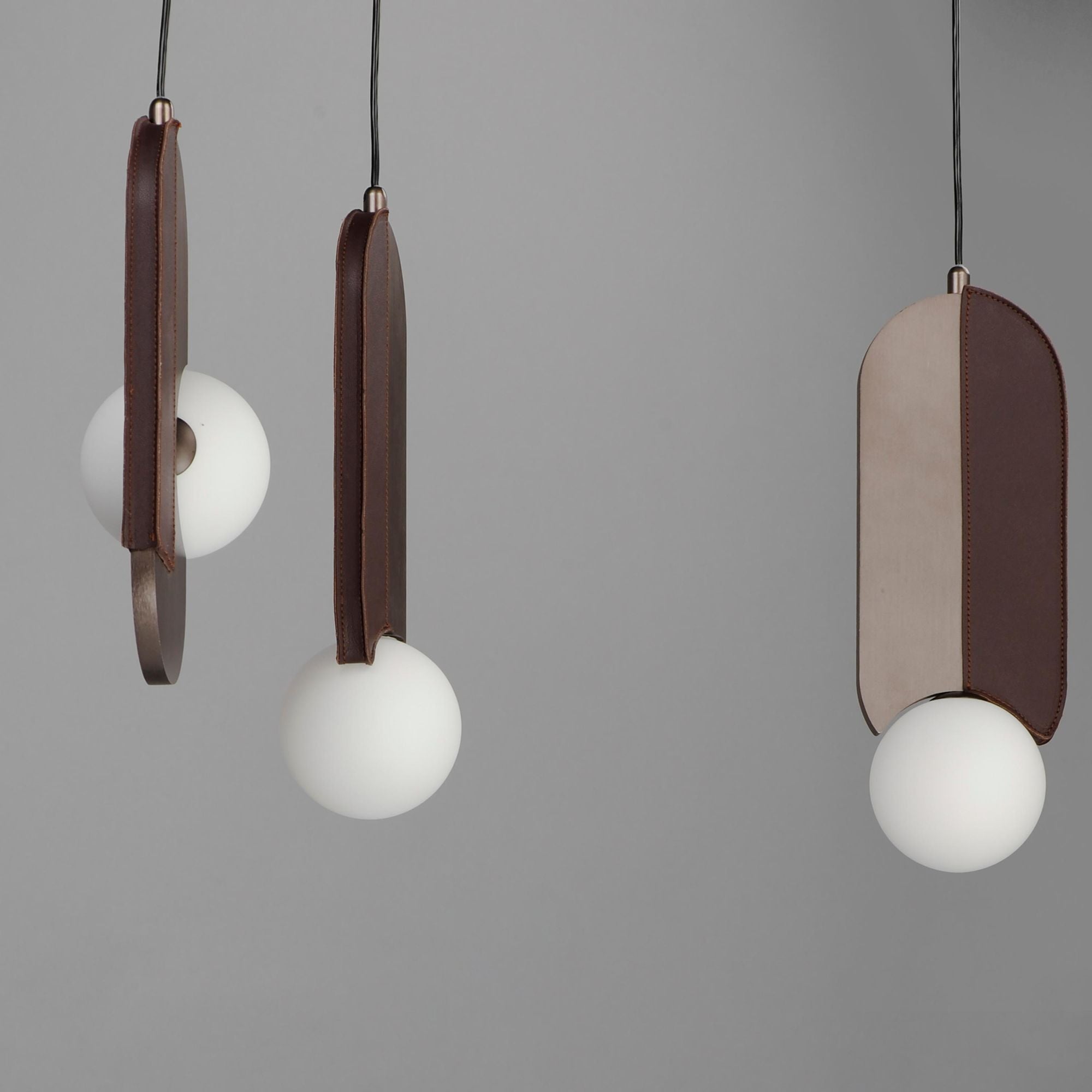 Studio M SM24608BBZ Stitched 8-Light Pendant in Brushed Bronze by Nina Magon