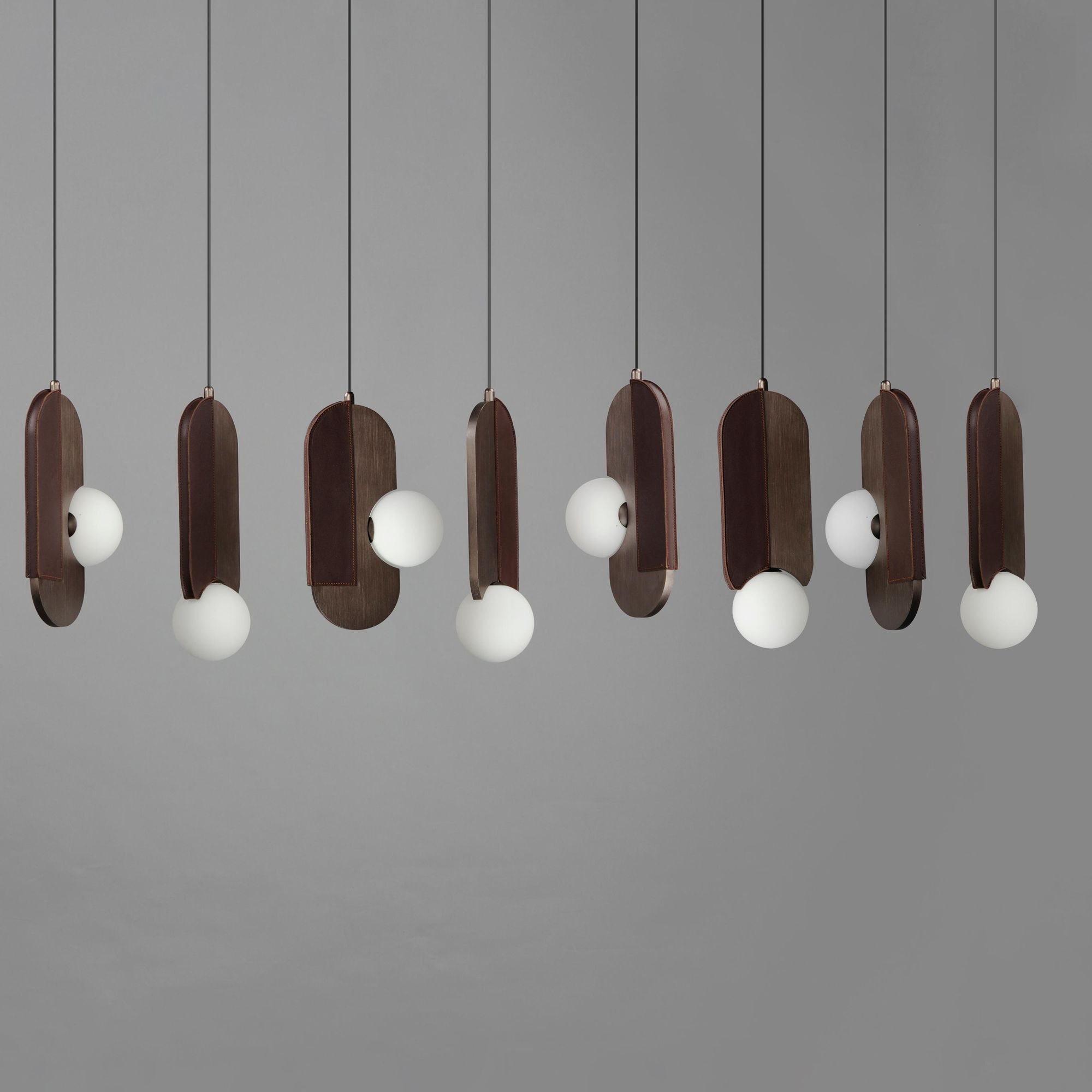 Studio M SM24608BBZ Stitched 8-Light Pendant in Brushed Bronze by Nina Magon