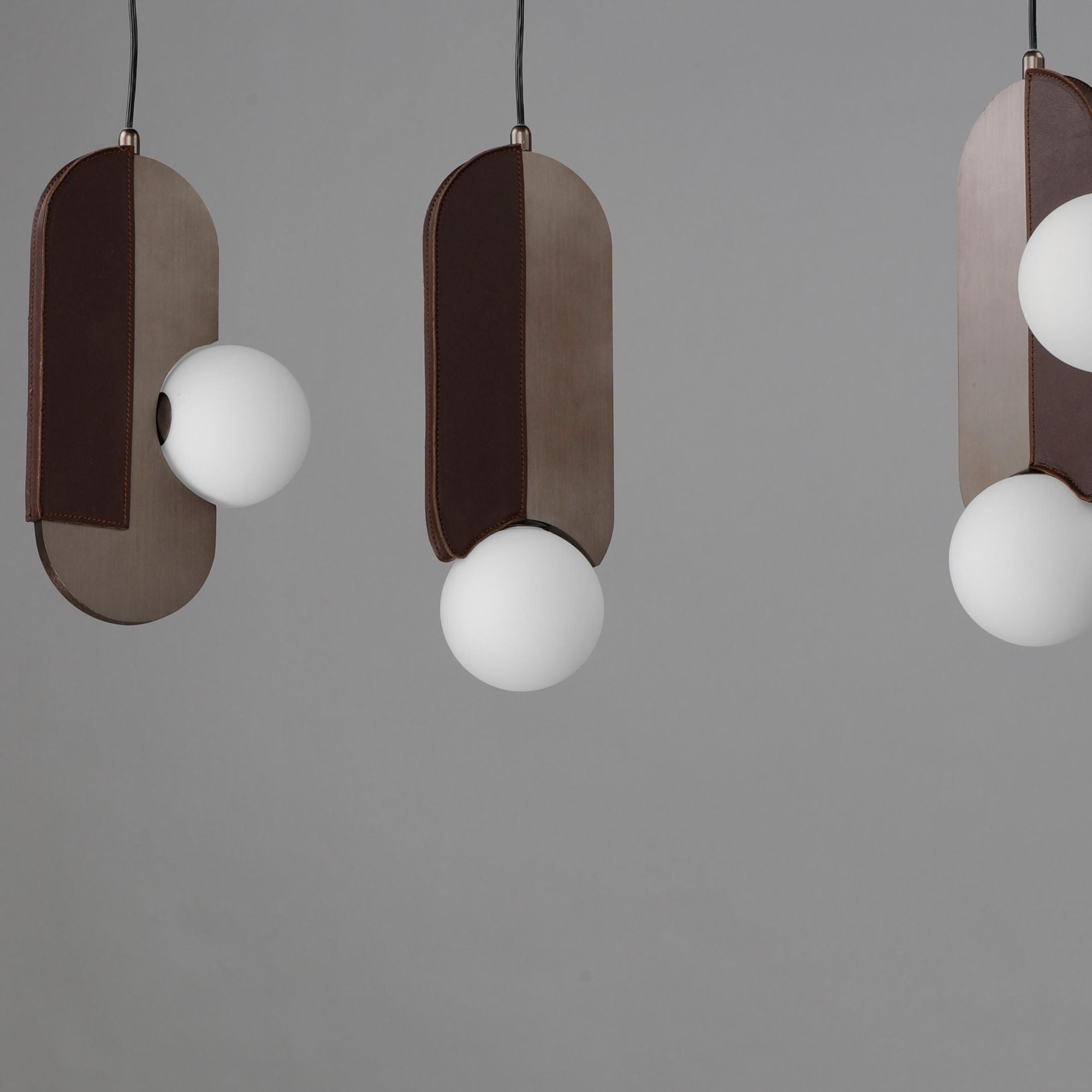 Studio M SM24608BBZ Stitched 8-Light Pendant in Brushed Bronze by Nina Magon